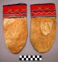 Pair of skin mittens with red cloth cuffs decorated with embroidery