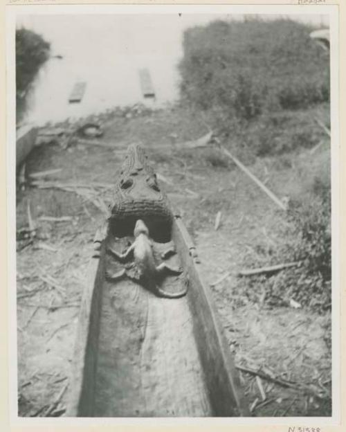 Figurehead of canoe with small figure