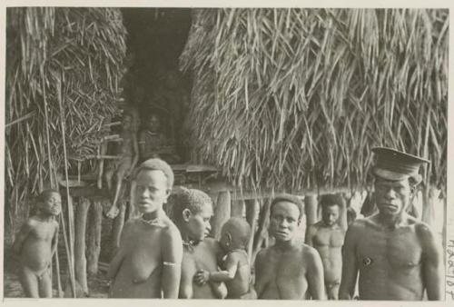 Government representative/interpreter with his three wives and children