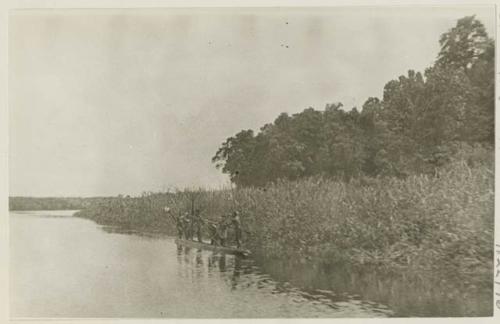 Men in small canoe