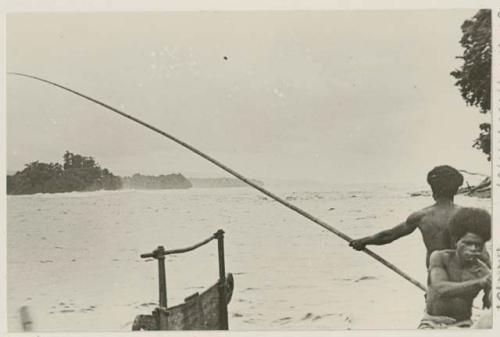 Men fishing for garfish