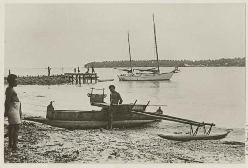 Outrigger canoe, larger boat and dock in background