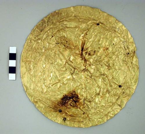 Disk shaped gold ornaments