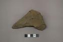 Archaeological, chipped stone, modified lithic with one end missing.