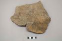 Archaeological, ceramic body sherds, decorated with linear, incised designs, crossmended and some reconstruction.