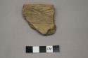 Archaeological, ceremic rim sherd, linear designs on body and on top of rim
