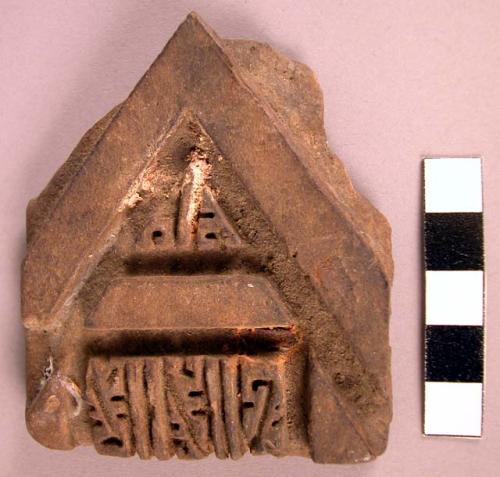 Flat pottery stamp with geometric design