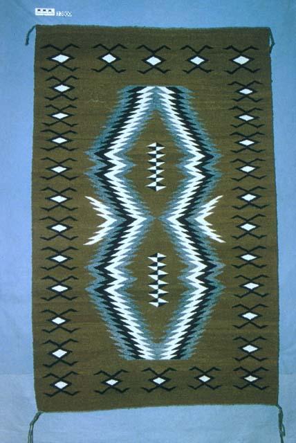 Rug, Two Grey Hills colors,central serrated diamonds, water bugs in borders