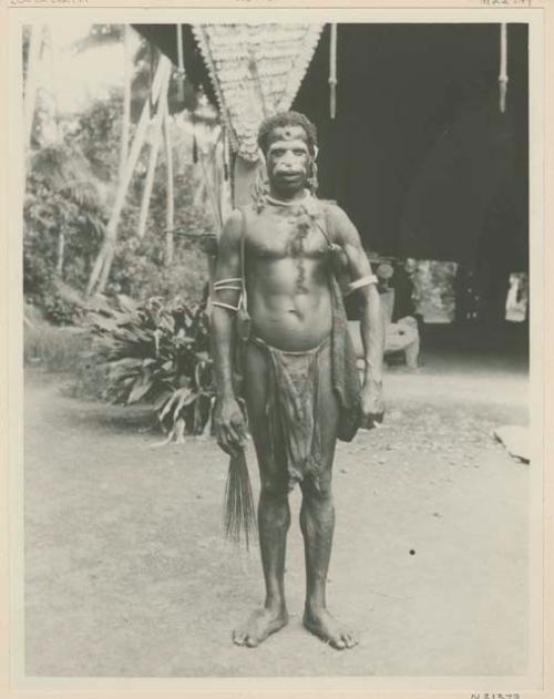 Man with lime gourd and bag