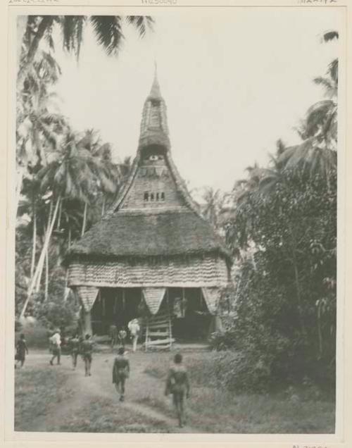 Men walking towards bachelor house