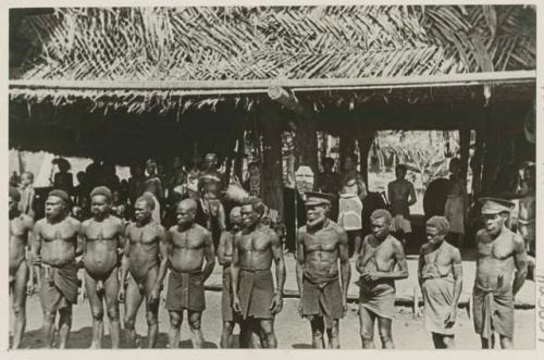 Line of people in front of building