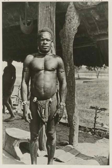 Man in front of structure