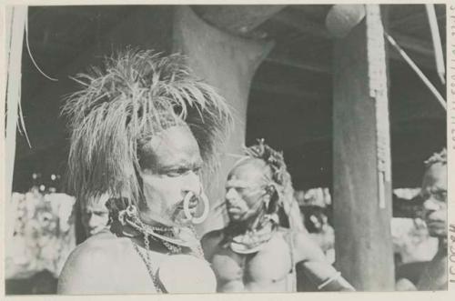 Man with ornate headdress and large nose ring