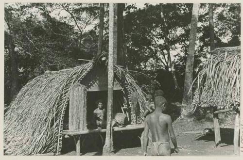 People around small building