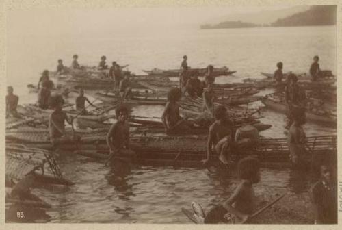 People in outrigger canoes