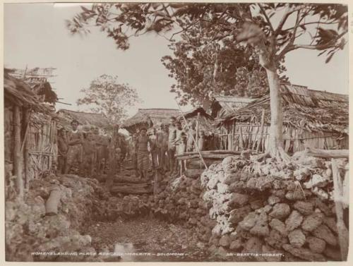 Men and boys at womens landing place at Adegege