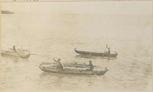 Men in canoes