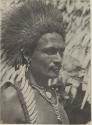 Man in headdress and necklaces