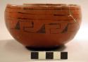 Small pottery bowl. Black-painted geometric design near rim.