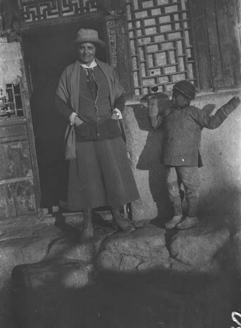 J.E.W. (Janet Wulsin) at Temple door with Child