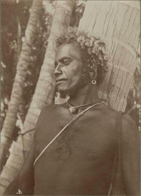 Man standing in front of a tree