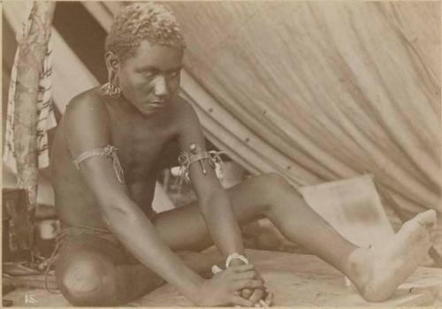 Man sitting inside tent