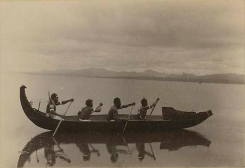 Four men in a canoe