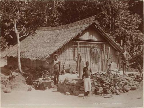 People in front of house