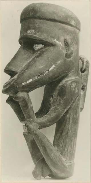 Carved anthropomorphic figure