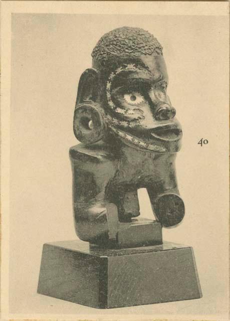 Carved warrior figure from canoe