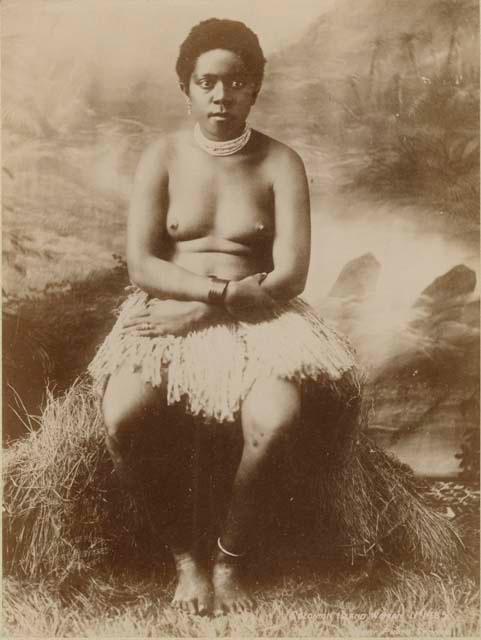 Studio portrait of woman sitting