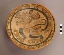 Pottery plate - thick red slip outside; polychrome inside;
