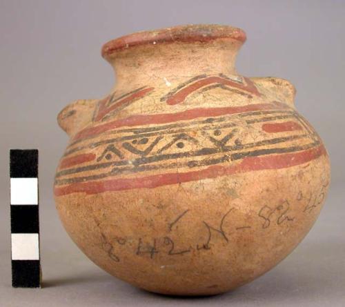 Pottery jar, animal head on sides