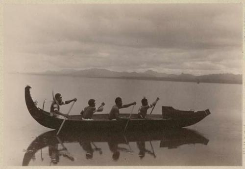 Four men in a canoe