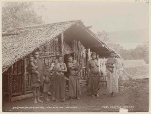 Group standing in front of house