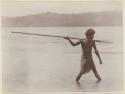 Man spearing fish in Roas Bay