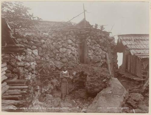 Man standing in front of fort in Qarea village