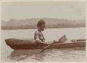 Woman of Port Adam in canoe