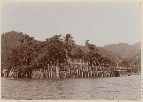 Posts for drying fishing nets, and men's quarters