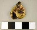 Gold bells, human faces. Cast trumbaga, Veraguas style. A.D. 900-1200 (exhibit n