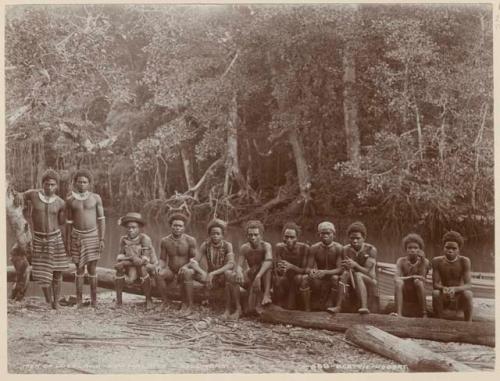 Group of men from Bulalaka sitting on a log