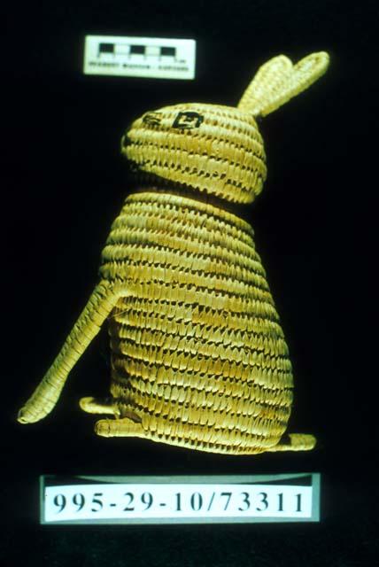 Coiled basketry seated rabbit (A) with removable head (B)