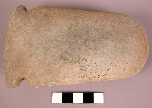 Stone axe with niches for hafting