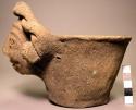 Pottery bowl with effigy head on rim