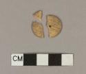 Carved, one hole bone button fragments; three fragments crossmend