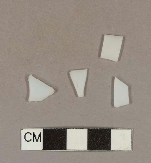 Milk white bottle glass fragments