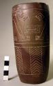 Ground stone cup, incised with geometric designs