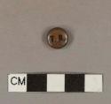 Enameled iron pin-back button, printed with "T.R."