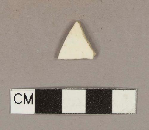 Undecorated cream-colored ironstone body sherd