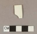 Undecorated cream-colored ironstone rim sherd